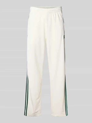 Spodnie dresowe o rozkloszowanym kroju z elastycznym pasem model ‘FIREBIRD’ adidas Originals
