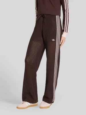 Spodnie dresowe o wyglądzie dzianiny w kroju regular fit model 'FIREBIRD' adidas Originals