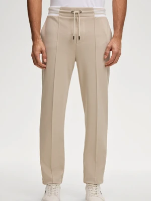Spodnie dresowe Tainan w kolorze piaskowym Joop