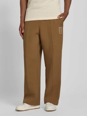 Spodnie dresowe w kroju loose fit z mieszanka bawełny model 'Tenn' Lacoste Granatowy