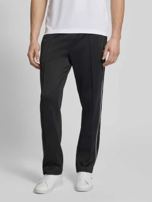 Spodnie dresowe w kroju regular fit z dodatkiem bawełny Lacoste