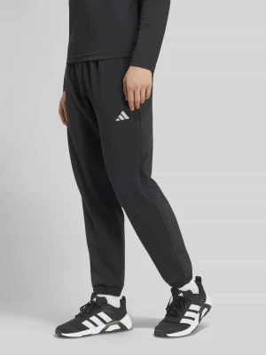 Spodnie dresowe w kroju regular fit z dodatkiem lyocellu Adidas Czarny