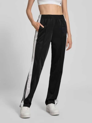 Spodnie dresowe z bocznymi listwami na zatrzaski model ‘ADIBREAK’ adidas Originals