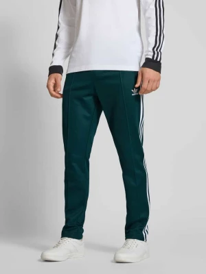 Spodnie dresowe z elastycznym pasem i kieszeniami na zamek błyskawiczny adidas Originals