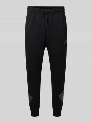 Spodnie dresowe z elastycznym pasem i tunelem adidas Sportswear