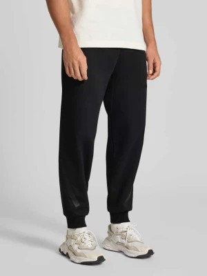 Spodnie dresowe z elastycznym pasem i tunelem adidas Sportswear