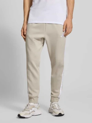 Spodnie dresowe z elastycznym ściągaczem adidas Sportswear