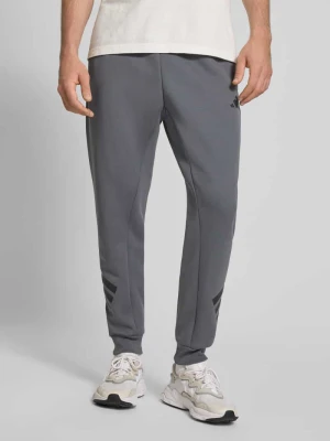 Spodnie dresowe z elastycznym ściągaczem adidas Sportswear