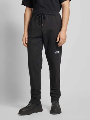 Zdjęcie produktu Spodnie dresowe z elastycznym ściągaczem The North Face