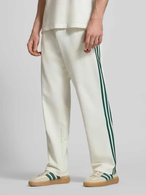 Spodnie dresowe z kieszeniami na zamek i haftowanym logo adidas Originals