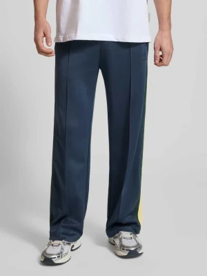 Spodnie dresowe z kieszeniami zapinanymi na zamek błyskawiczny i trokiem ANOTHER COTTON LAB