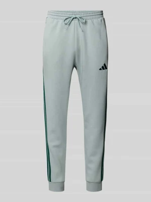 Spodnie dresowe z logo i elastycznym pasem adidas Sportswear