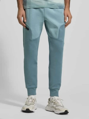 Spodnie dresowe z logo model ‘Unstoppable’ Under Armour