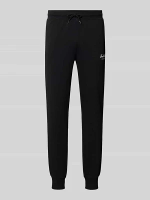 Spodnie dresowe z nadrukiem z logo model 'GORDON' Jack&Jones Czarny