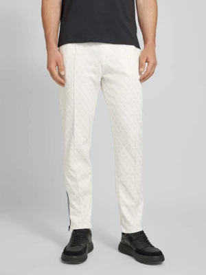 Spodnie dresowe z nadrukiem z logo na całej powierzchni model ‘KORBIN’ Guess Activewear