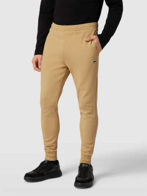 Spodnie dresowe z naszywką z logo model ‘TRACKSUIT TROUSERS’ Lacoste