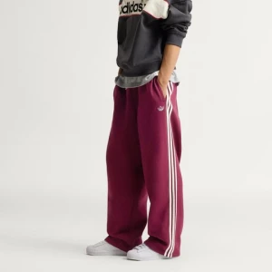 Spodnie dresowe z nogawkami bez ściągaczy i 3 paskami adiSignature Adidas beżowy