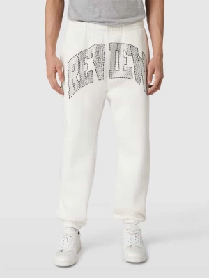 Spodnie dresowe z obszyciem kamieniami stras z logo REVIEW