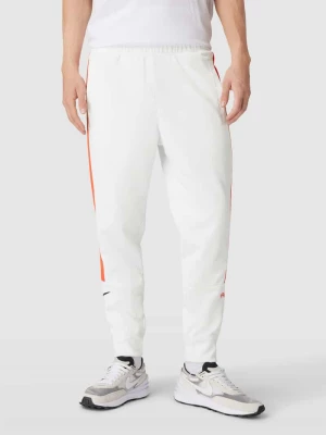 Spodnie dresowe z paskami w kontrastowym kolorze Nike