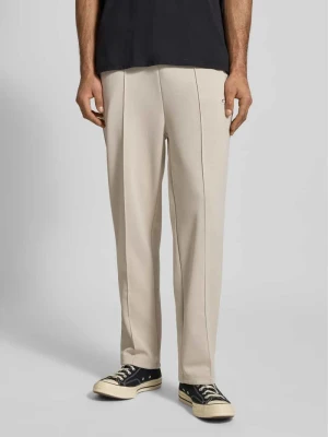 Spodnie dresowe z wyhaftowanym logo model ‘Motus Track Pants’ Pegador Écru