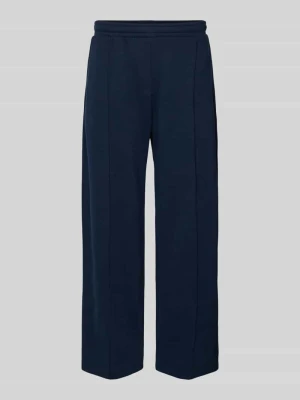 Spodnie dresowe z zaszewką i emblematem w stylu college REVIEW