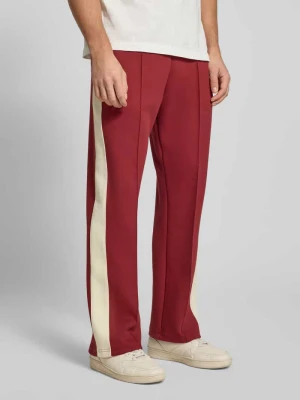 Spodnie dresowe ze szwami podłużnymi i elastycznym pasem Karl Kani