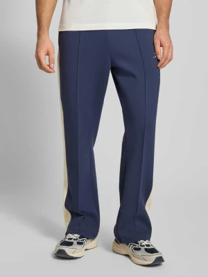 Spodnie dresowe ze szwami podłużnymi i nadrukiem z logo Karl Kani