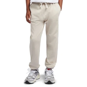 Spodnie dziecięce New Balance LAKB0060TWF - beżowe