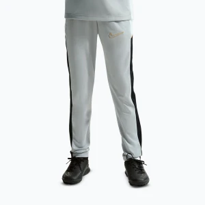 Zdjęcie produktu Spodnie dziecięce Nike Academy Dri-Fit Jr light smoke grey/white/black/metallic gold