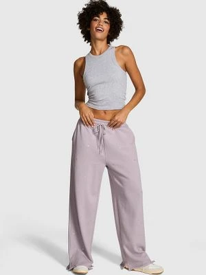 PINK Spodnie bawełniane Ivy Fleece z szeroką nogawką i rozcięciem Victoria's Secret Fioletowy