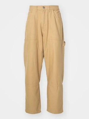 Spodnie materiałowe Alpha Industries piaskowy