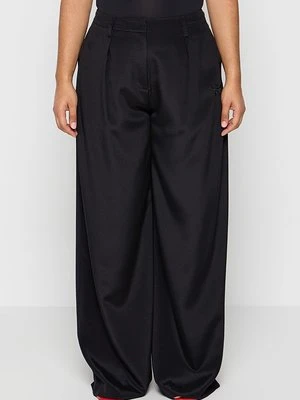 Spodnie materiałowe MCM