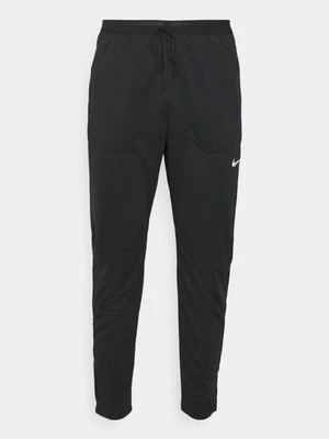 Spodnie materiałowe Nike Performance