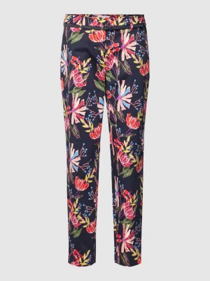 Spodnie materiałowe o kroju slim fit z kwiatowym wzorem Christian Berg Woman