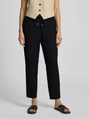 Spodnie materiałowe o kroju tapered fit z wpuszczanymi kieszeniami Christian Berg Woman