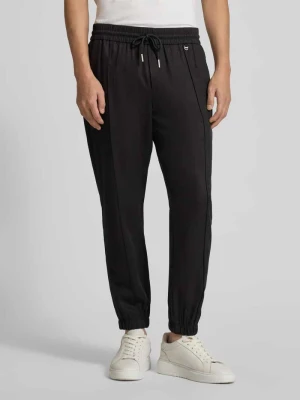 Spodnie materiałowe o luźnym kroju z mieszanki lyocellu i lnu Antony Morato