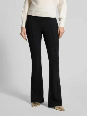 Spodnie materiałowe o rozkloszowanym kroju z elastycznym pasem model ‘Evelina’ Guess