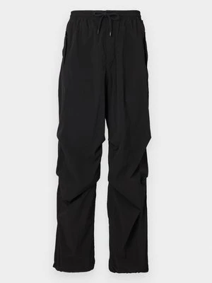 Spodnie materiałowe Tommy Jeans czarny