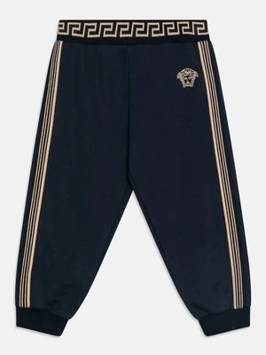 Spodnie materiałowe Versace