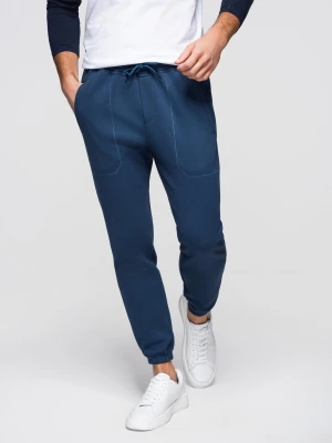 Spodnie męskie dresowe CARROT ze strukturalnej dzianiny - ciemnoniebieskie V5 - Rozmiar: L Ombre Clothing