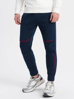 Spodnie męskie dresowe z kontrastowymi przeszyciami - granatowe V4 - Rozmiar: L Ombre Clothing