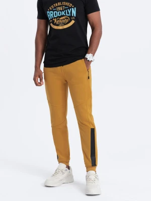 Spodnie męskie dresowe z przeszyciami - żółte V7 - Rozmiar: M Ombre Clothing