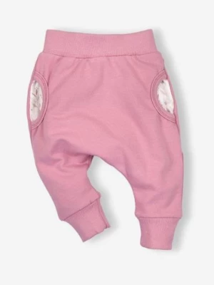 Spodnie niemowlęce z bawełny organicznej dla dziewczynki różowe NINI