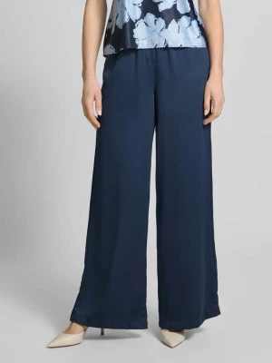 Spodnie o kroju loose fit z elastycznym pasem i kieszeniami wpuszczanymi Christian Berg Cocktail