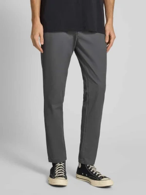 Spodnie o kroju slim fit z wpuszczanymi kieszeniami model ‘MARCO’ jack & jones