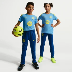 Spodnie piłkarskie z dzianiny dla dużych dzieci Nike Dri-FIT FC Barcelona Strike (wersja czwarta) - Niebieski
