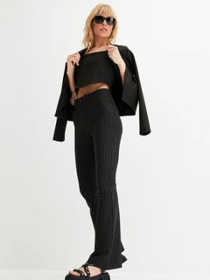 Spodnie poszerzane w tenisowe prążki bonprix