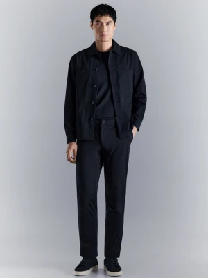 Spodnie slim fit water-repellent granatowy - Mężczyzna - - MANGO MAN