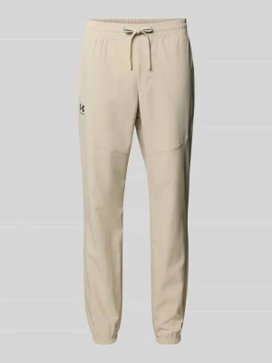 Spodnie sportowe o kroju regular fit z nadrukiem z logo model ‘Vibe’ Under Armour