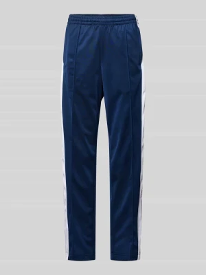 Spodnie sportowe o kroju straight fit z elastycznym pasem model ‘Adibreak’ adidas Originals